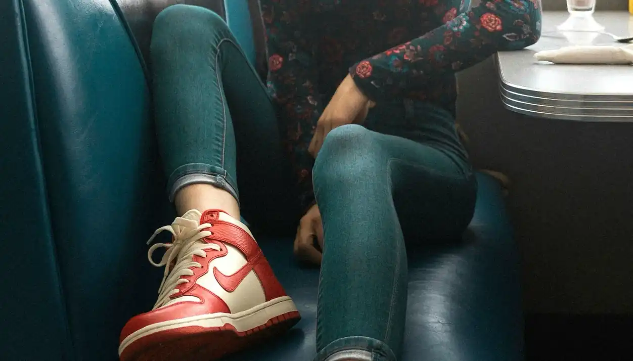 Close-up of worn red and white shoes - category and link worn shoes in the online store.